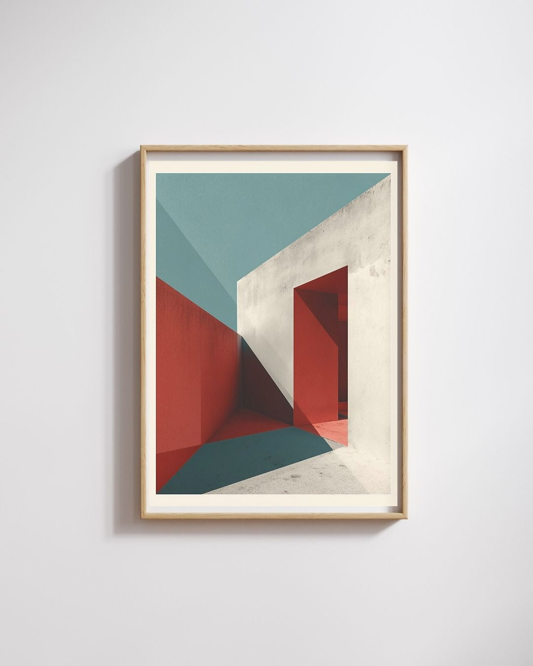 Framed abstract art print with geometric shapes on a light gray wall