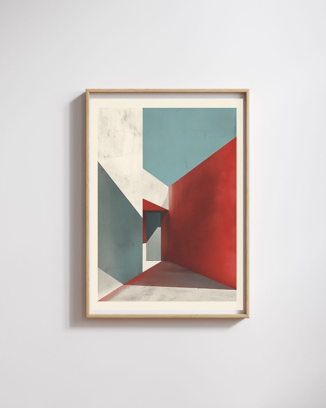 Framed abstract art with geometric shapes on a light gray wall