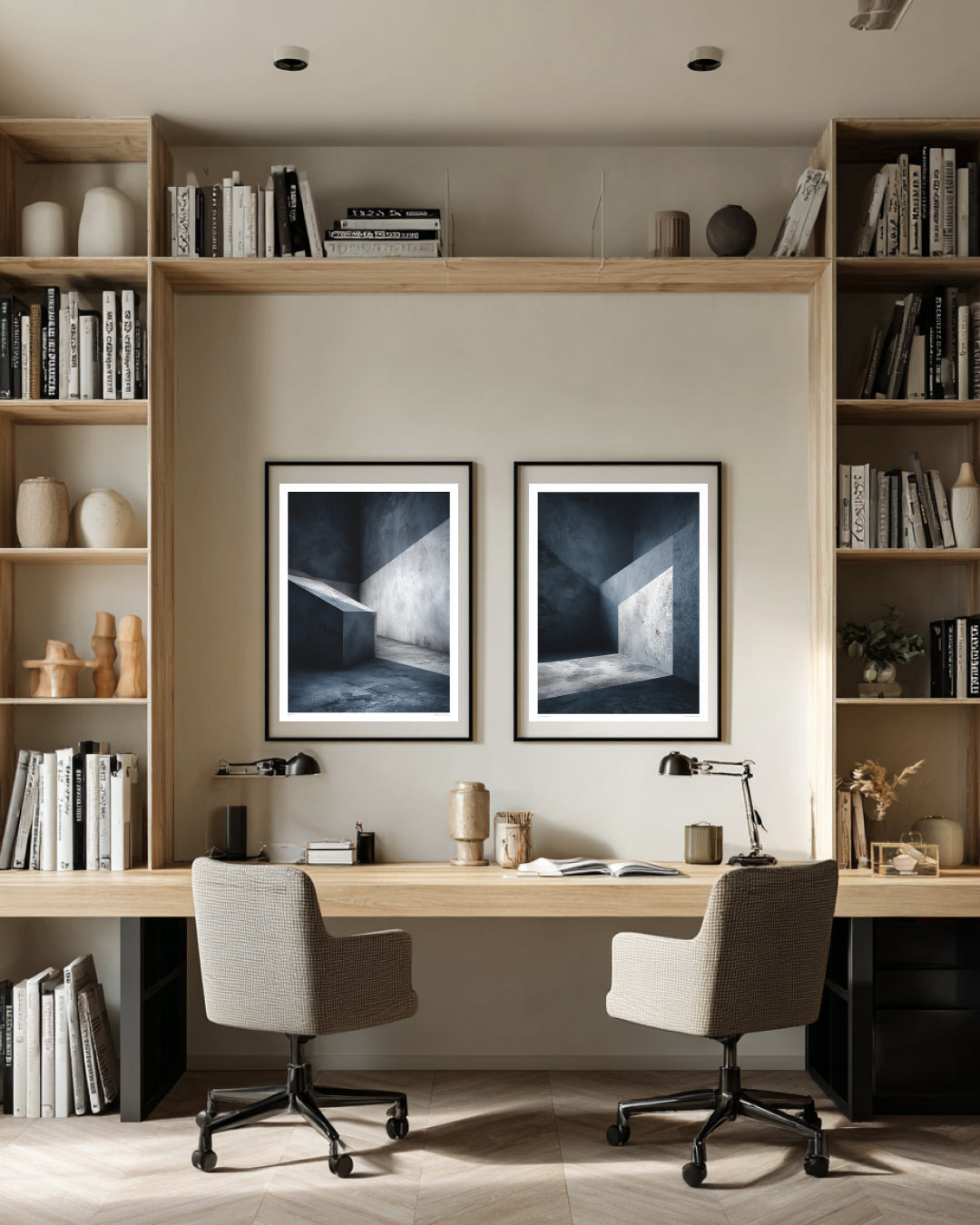 Modern home office with bookshelves, desk, and framed artwork.