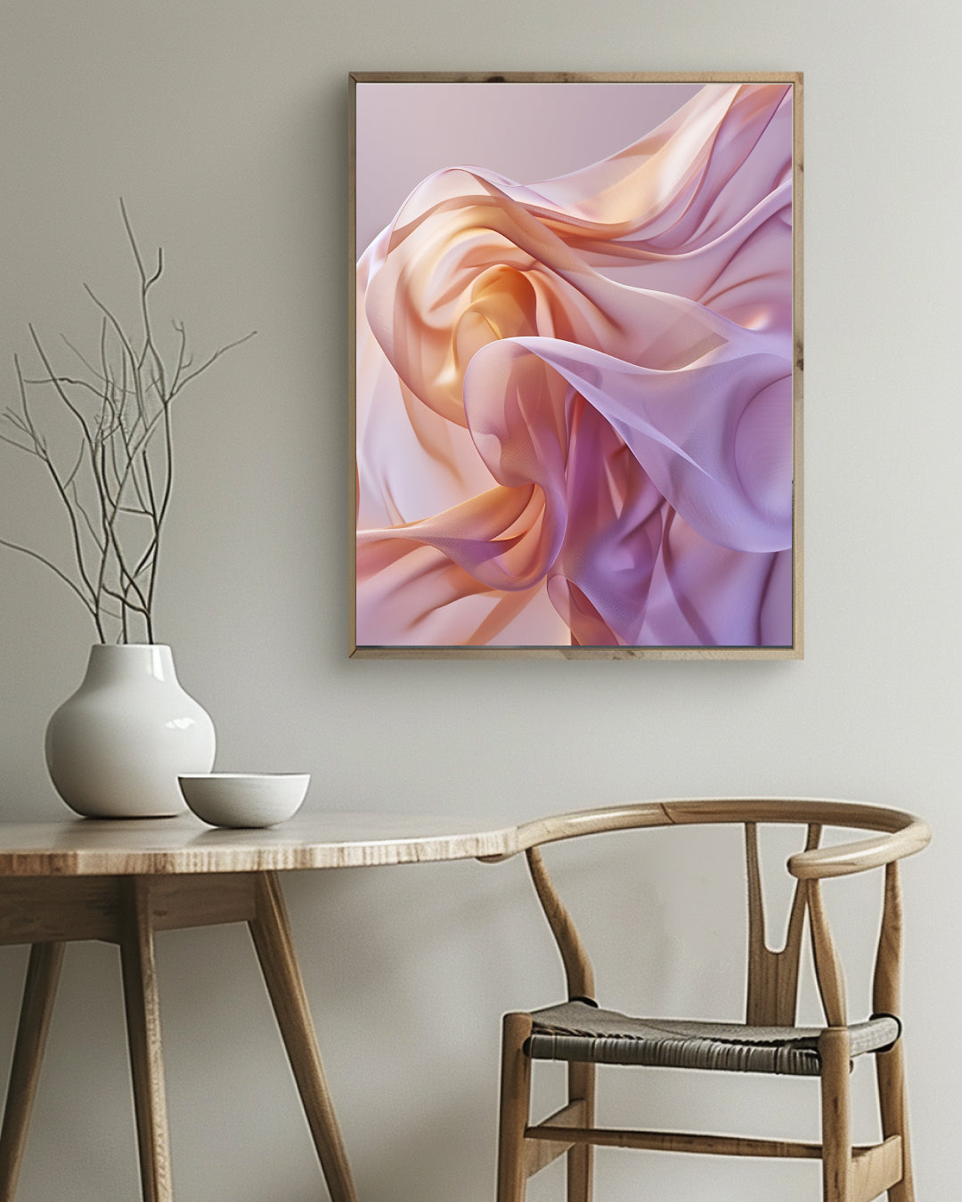 Framed abstract art piece on a wall above a wooden table with a vase and bowl.